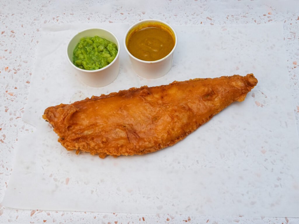 Battered haddock with mushy peas and curry sauce at A&Z Fish & Chips, Maidstone
